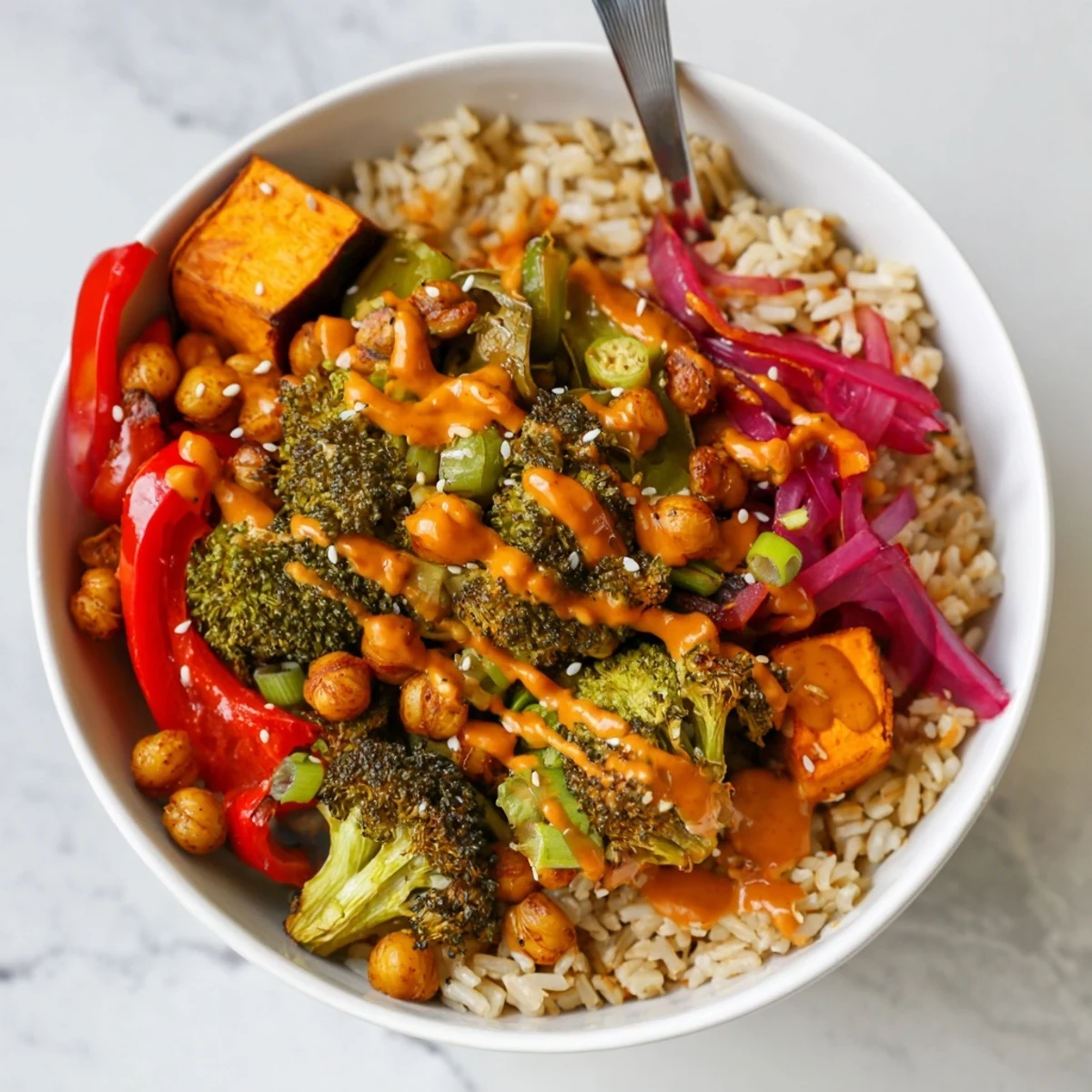 Delicious Bold Sauce Drizzle Bowls, bursting with roasted vegetables and savory toppings.