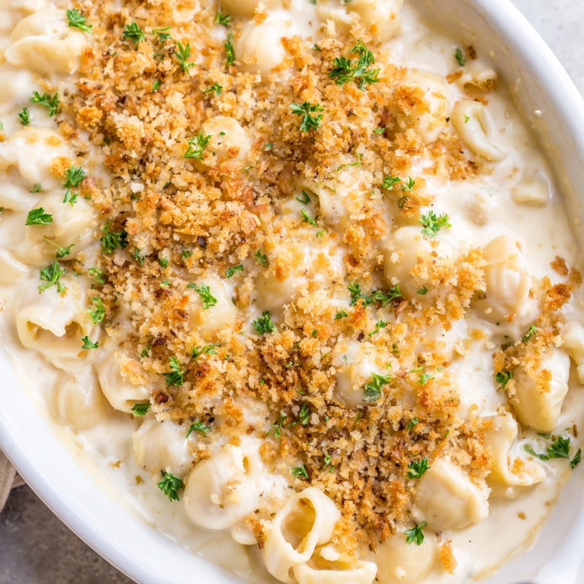 Decadent truffle macaroni and cheese topped with golden panko breadcrumbs, ready to serve.  