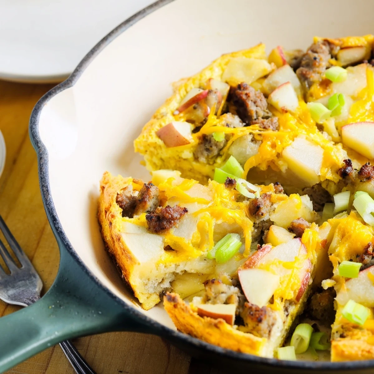 Golden-brown Savory Apple, Sausage, and Cheddar Scone Skillet, perfect for a cozy brunch.