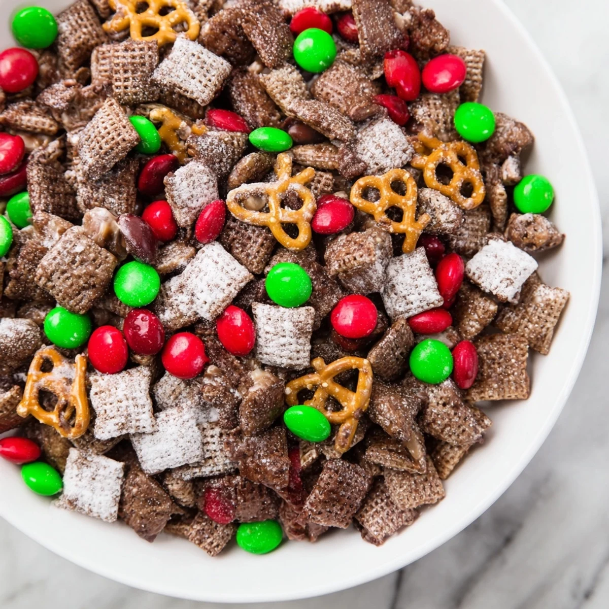 Enjoy the easy-to-make Simplified Reindeer Chow, perfect for sharing and satisfying your sweet cravings.