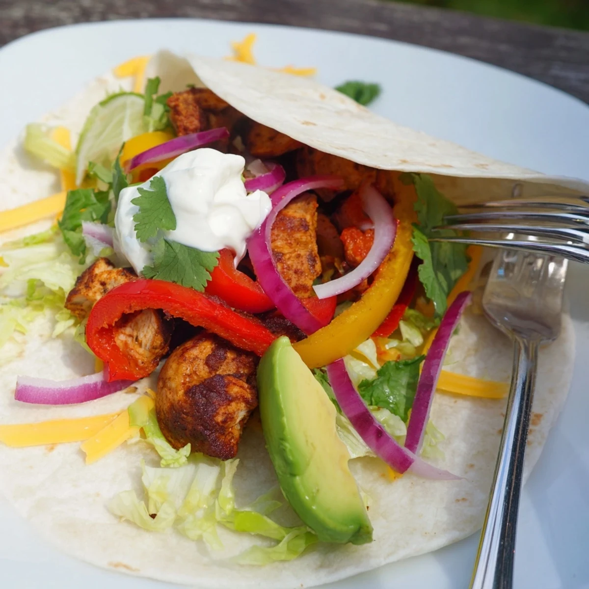 Sheet-Pan Fajita Chicken Rainbow Wraps: Tender chicken and colorful roasted veggies in warm tortillas, ready to eat.