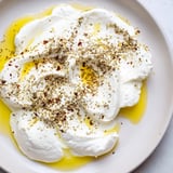 Tangy, homemade Levantine labneh cheese, thick and smooth, perfect for spreading on warm pita.