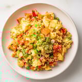 This vibrant photo showcases perfectly cooked Egg Fried Rice, a quick and satisfying dinner with fresh scallions.