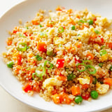 A healthy vegetarian plate of cauliflower fried rice, bursting with fresh flavors and textures.