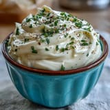 Velvety, garlicky aioli made from scratch, ideal for seafood, vegetables, or as a flavorful sandwich spread.
