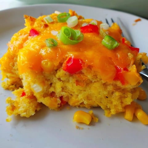 Golden Cheesy Cajun Cornbread Casserole bubbling hot from the oven, ready to slice and serve.