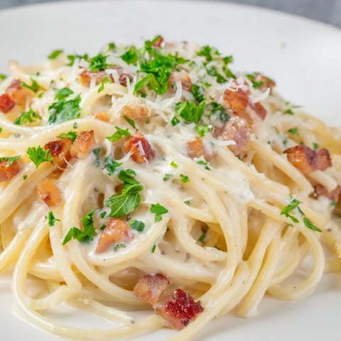 Golden, crispy bacon bits mingle in this creamy garlic bacon pasta, ready to warm your soul.