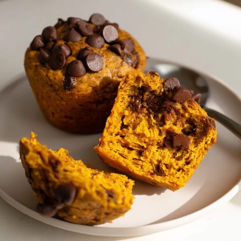 Deliciously spiced vegan pumpkin chocolate chip muffins, ideal for breakfast or snacks.  