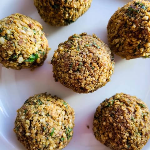 Close-up of flavorful, fried Levantine falafel balls, showcasing their perfectly textured, delicious exterior.