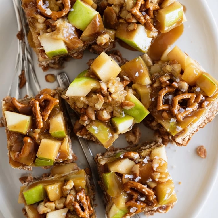 Warm caramel apple spicy pretzel biscuit bars served with a scoop of vanilla ice cream.