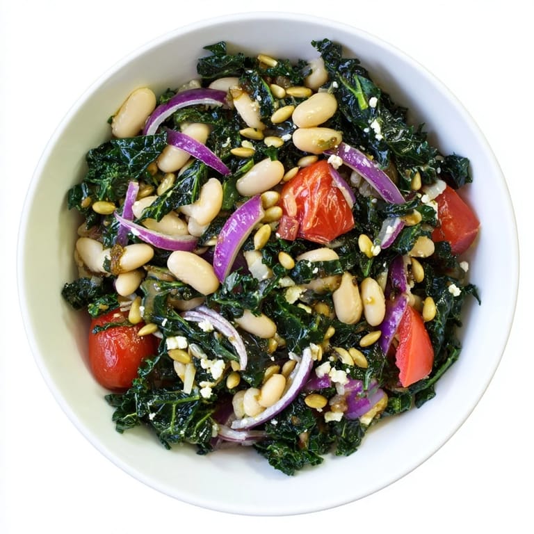 Enjoy a close-up of this White Bean and Kale Salad, showcasing fresh kale leaves, white beans, and optional feta cheese on a rustic wooden table.